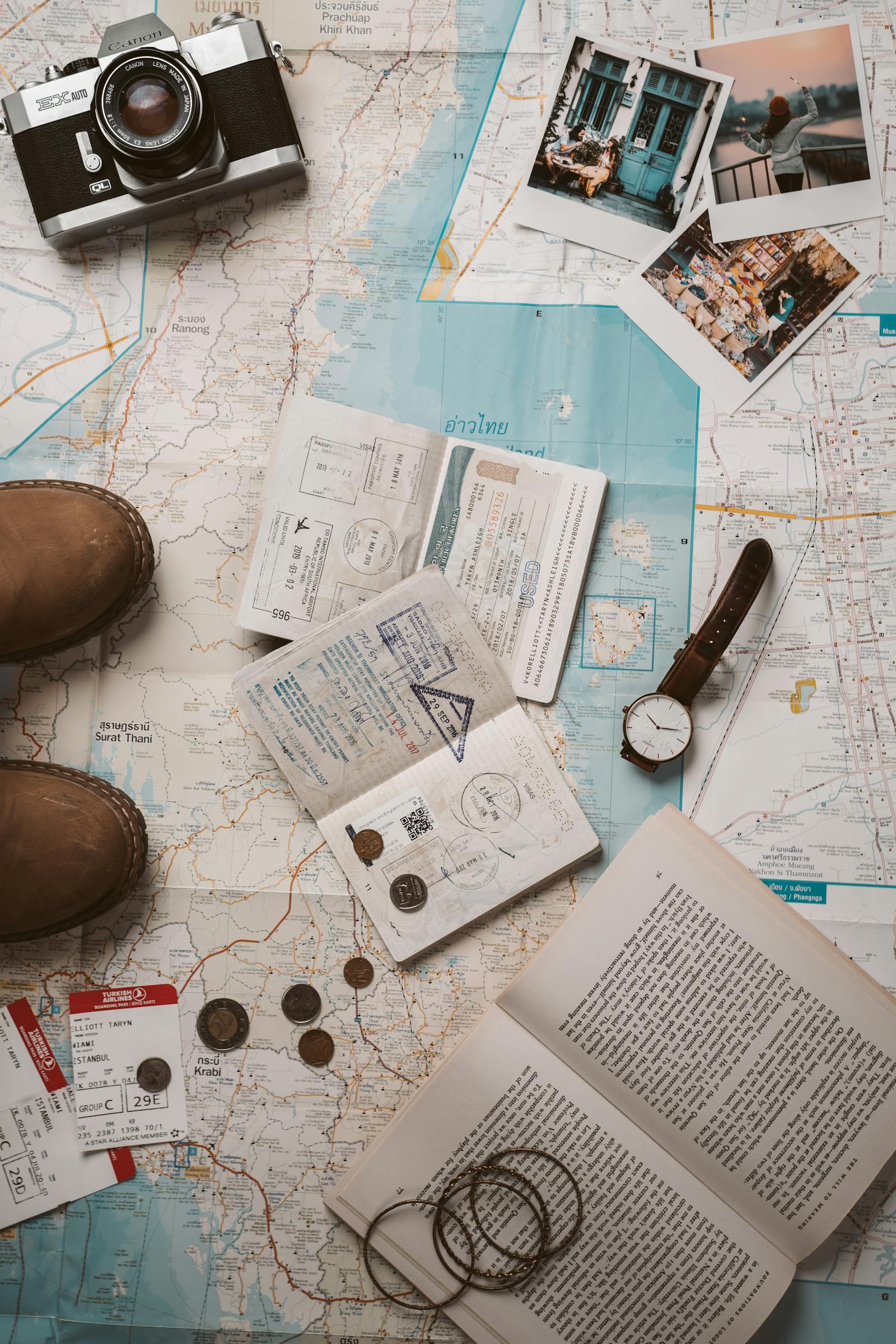 Travel flat lay with map, camera and passport