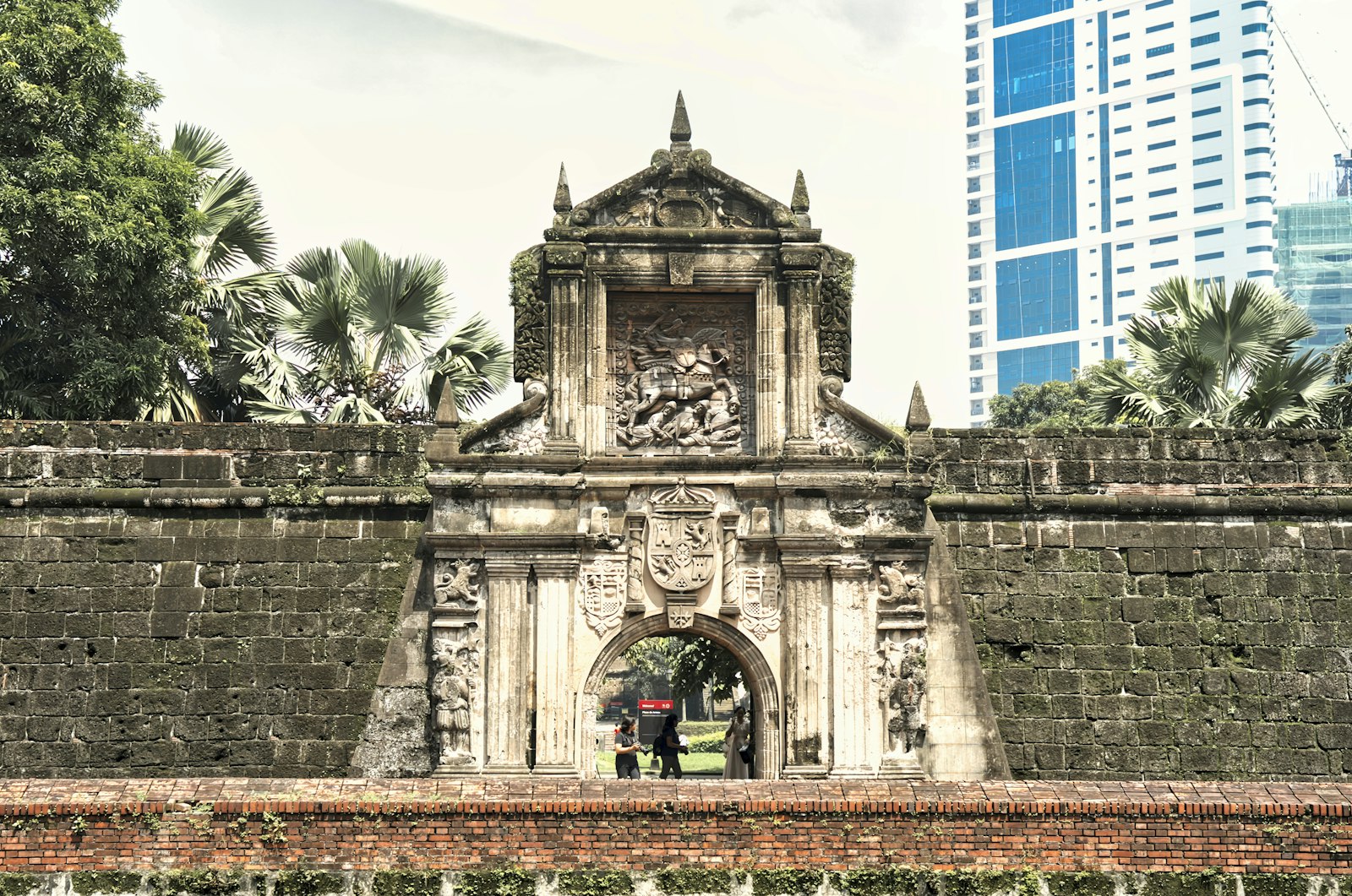 Stone gate and clock tower in Intramuros Manila