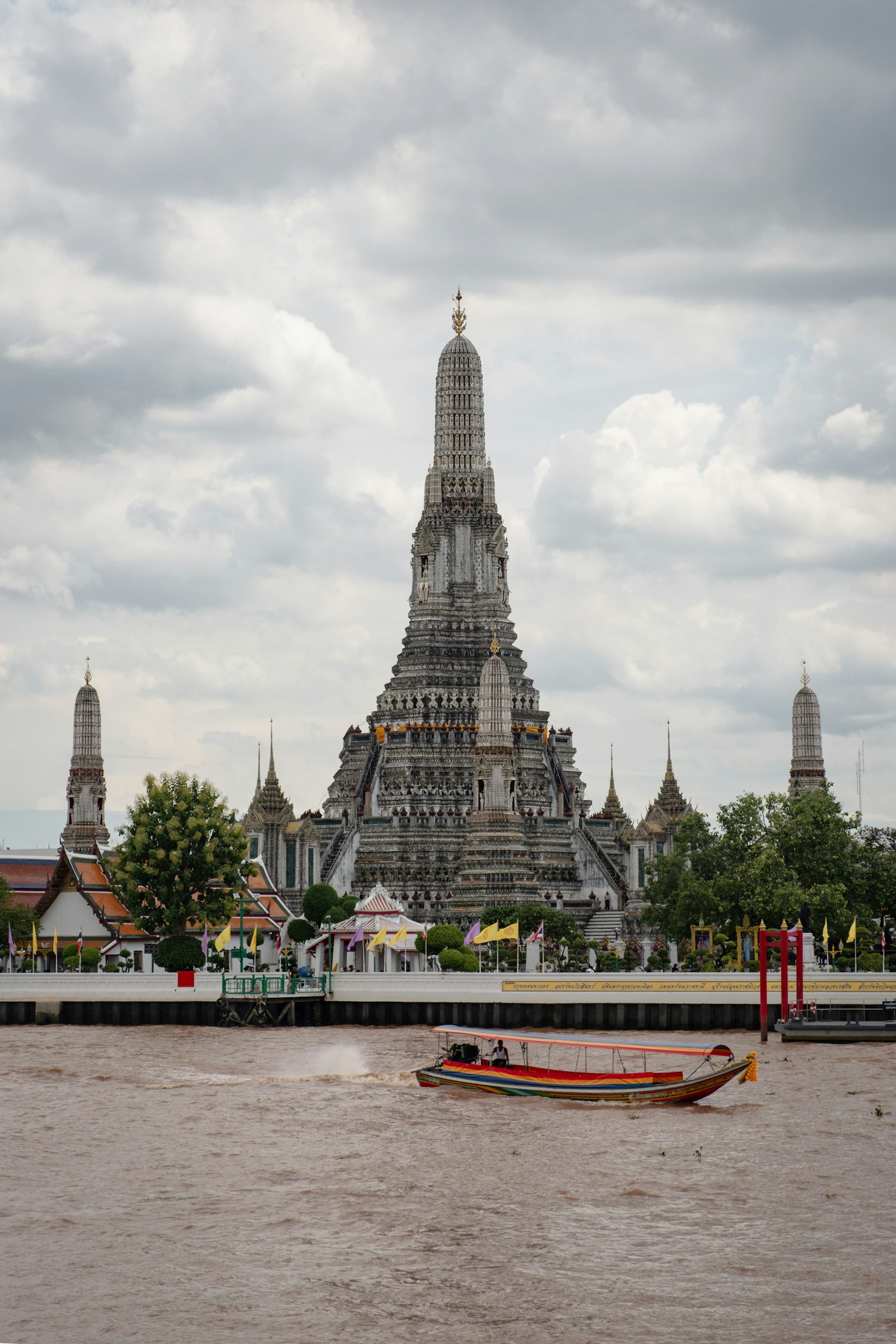 Wat Arun temple on the Chao Phraya River at dusk