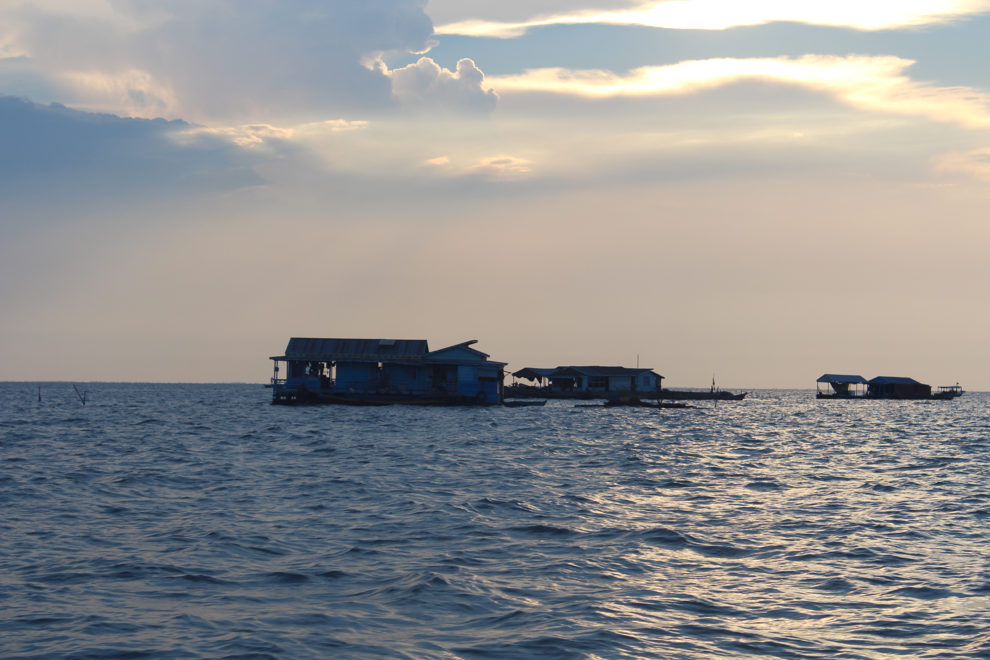 Floating houses on the Tonle Sap at golden hour