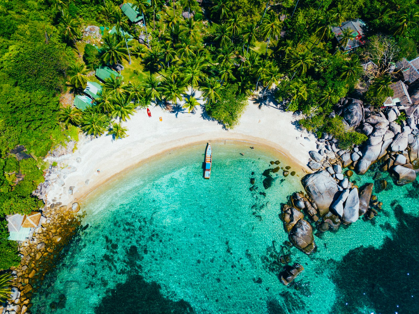 Aerial of a green-tinted cove on a Thai Gulf island