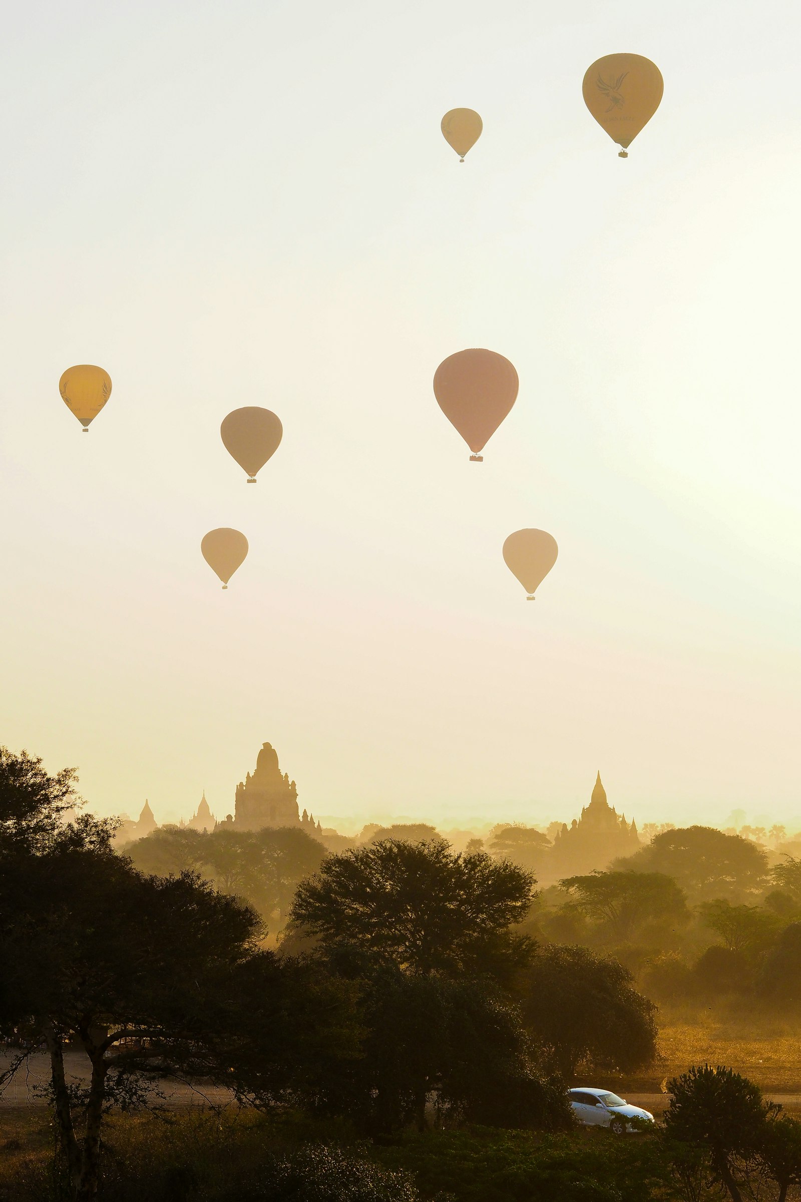 Hot air balloons rising over Bagan temples at sunrise