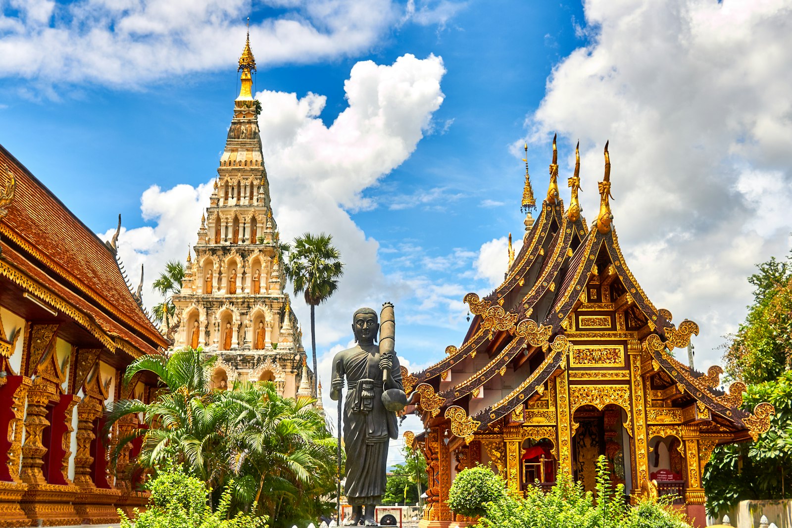 Gilded northern Thai temple under a clear blue sky