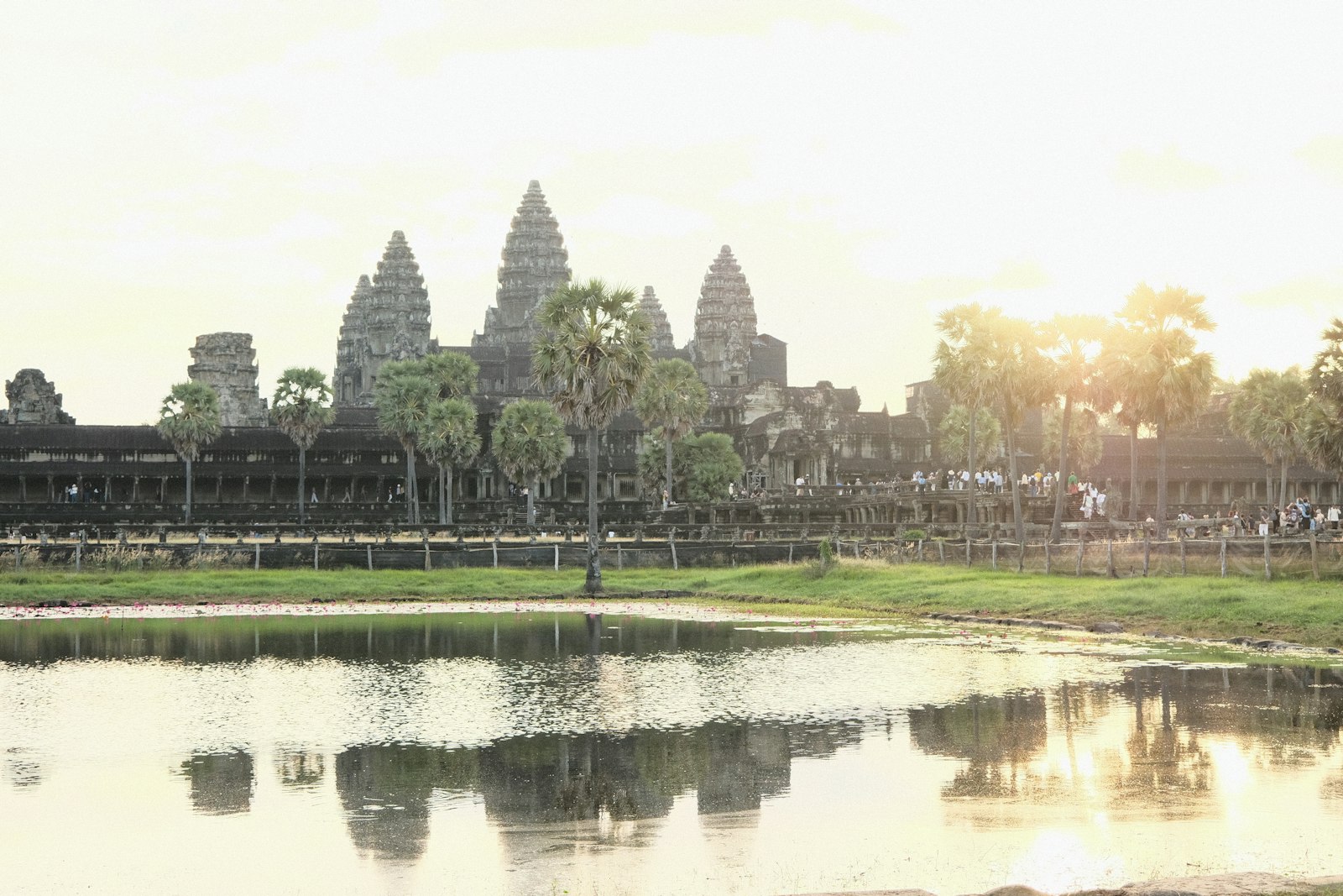 Angkor Wat towers reflected in water at sunrise