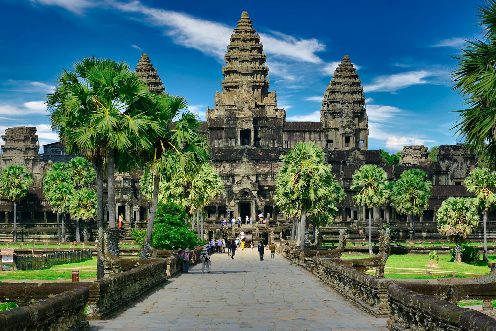Visitors walking through Angkor Wat park