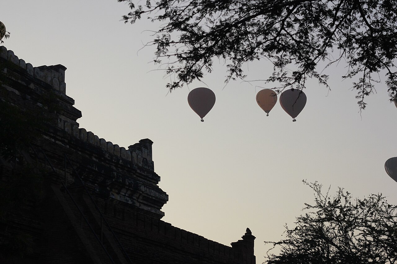 Bagan temples and balloons at sunrise across the plain