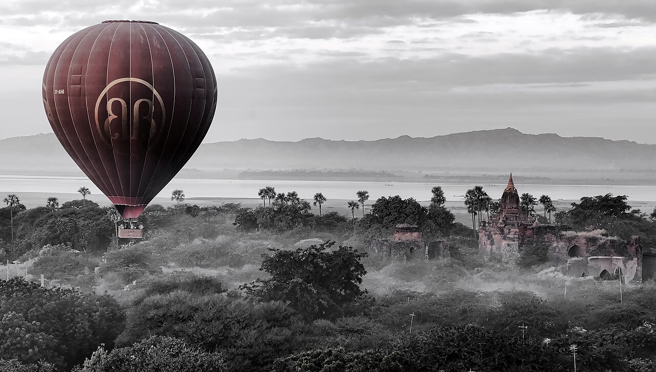 Hot air balloons drifting over the Bagan temple plain at dawn