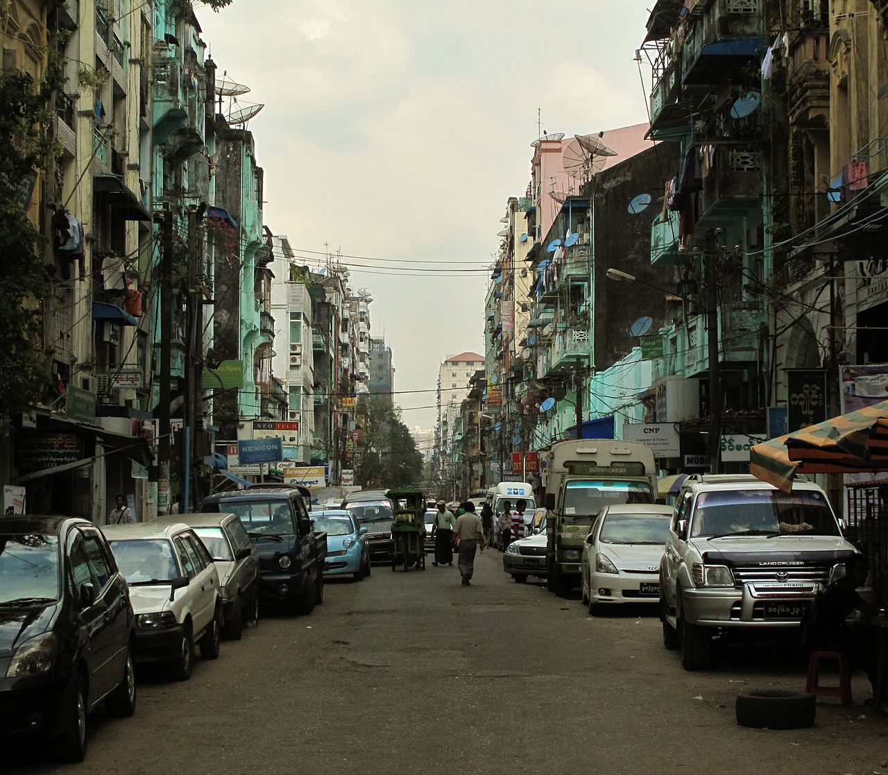Downtown Yangon street scene with vendors and pedestrians