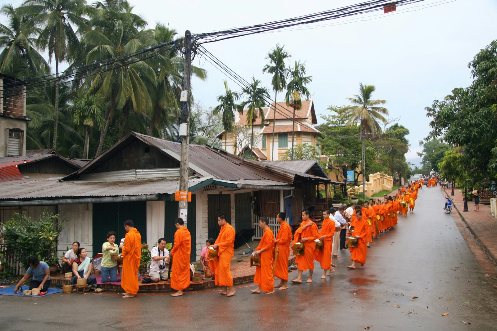 Buddhist monks receiving alms in the early morning