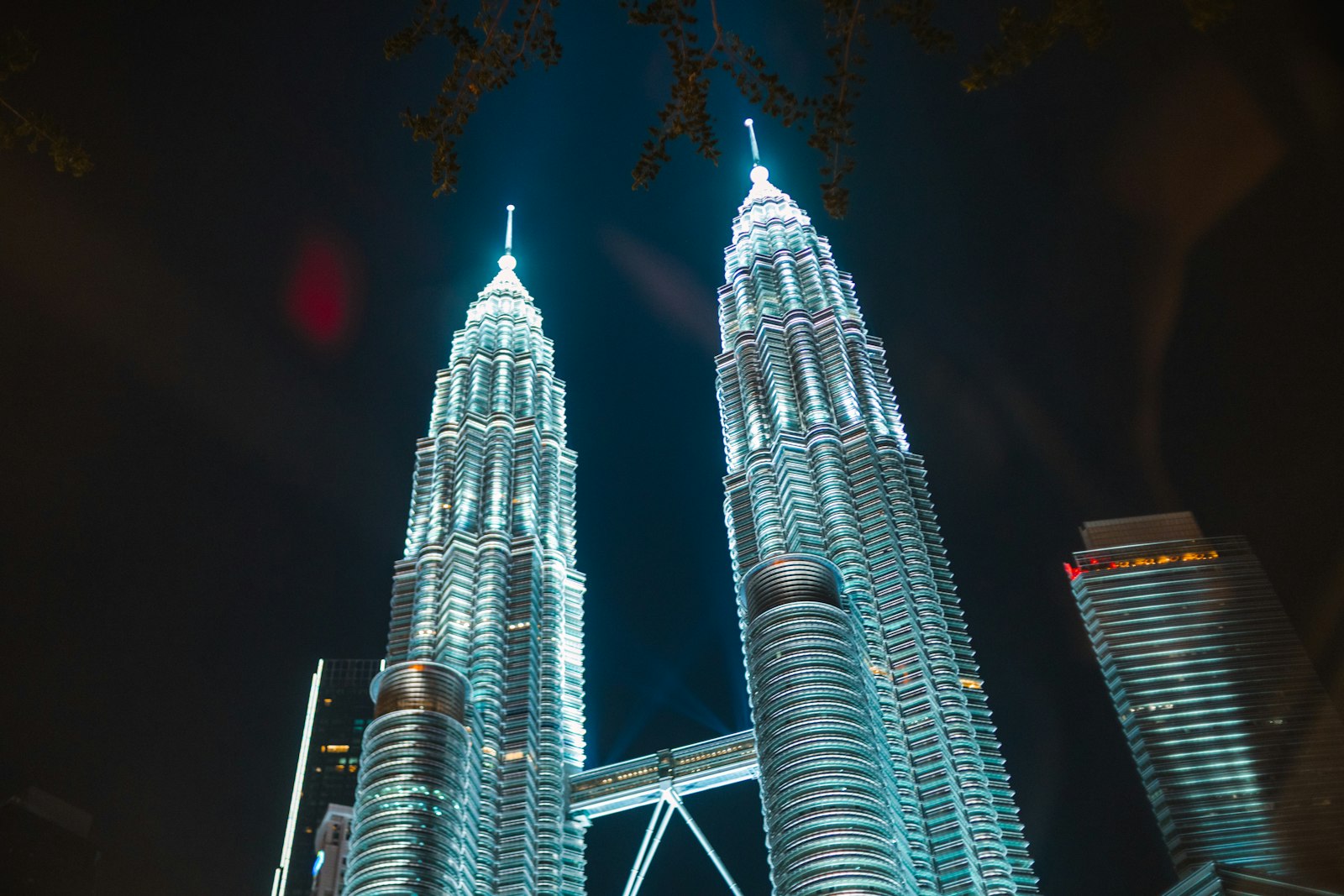 Petronas Towers illuminated at night in Kuala Lumpur