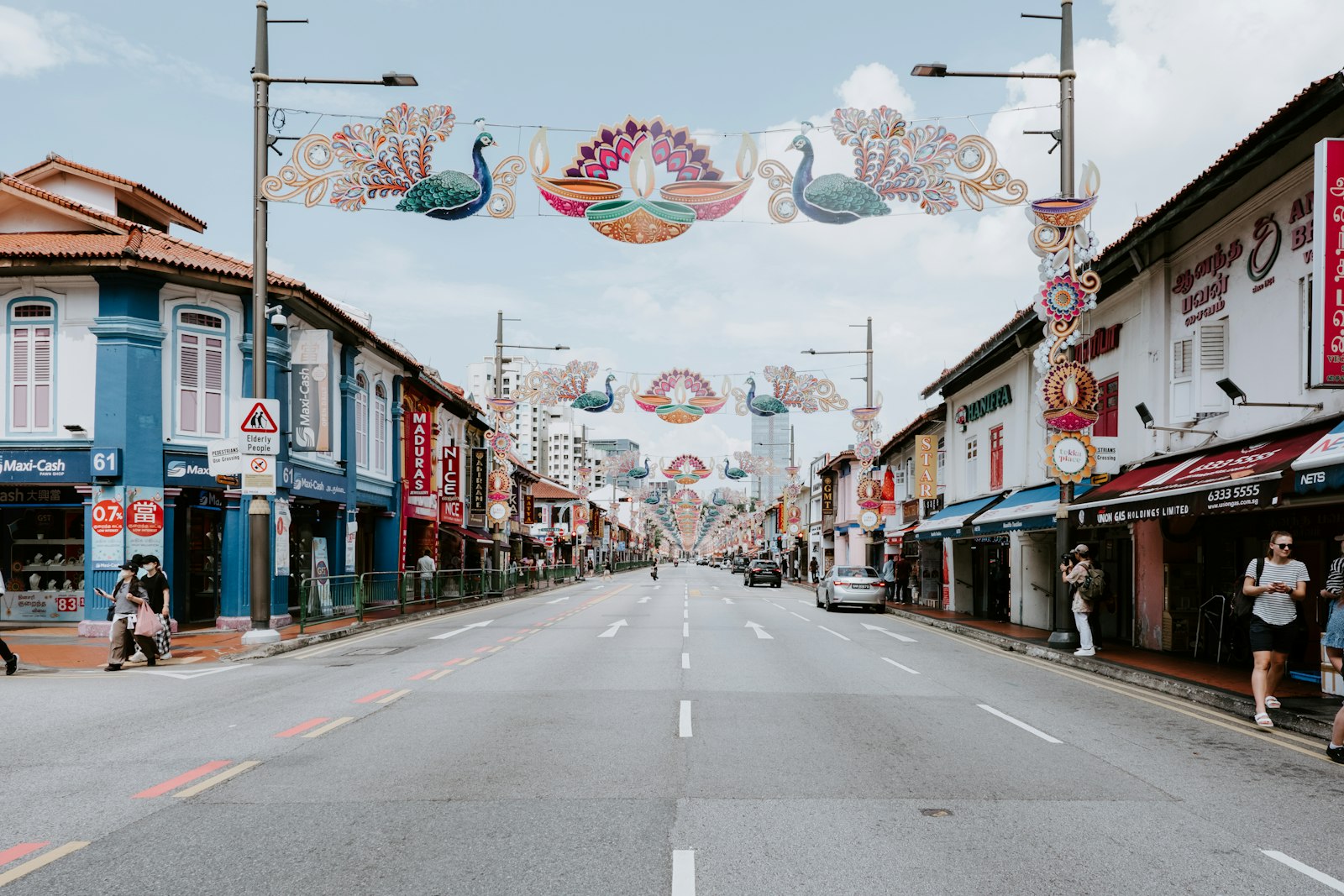 Orchard Road shopping street in Singapore lined with shops and pedestrians