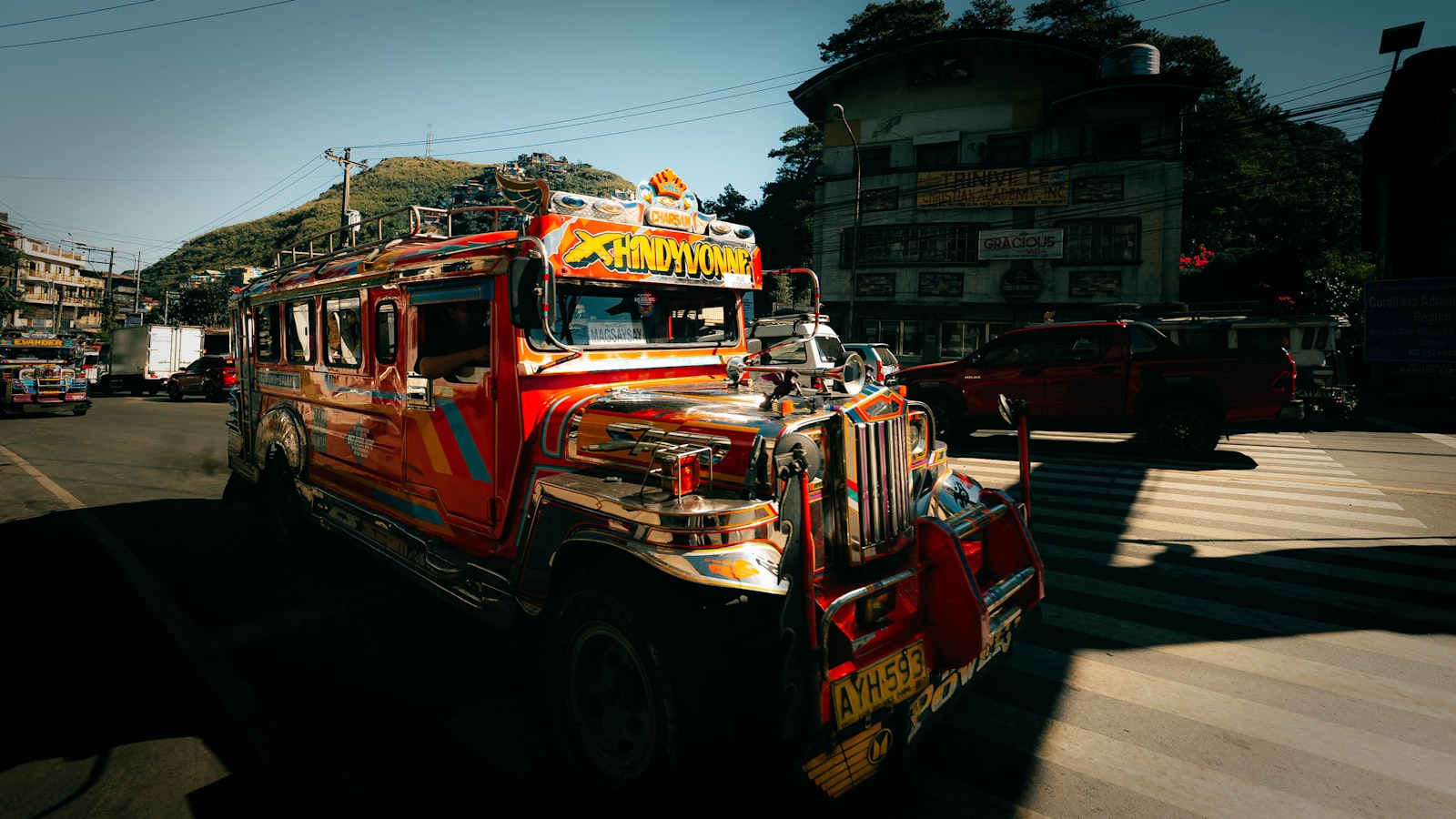 Colorful Philippine jeepney driving through a city — the daily commute vehicle that costs cents per ride