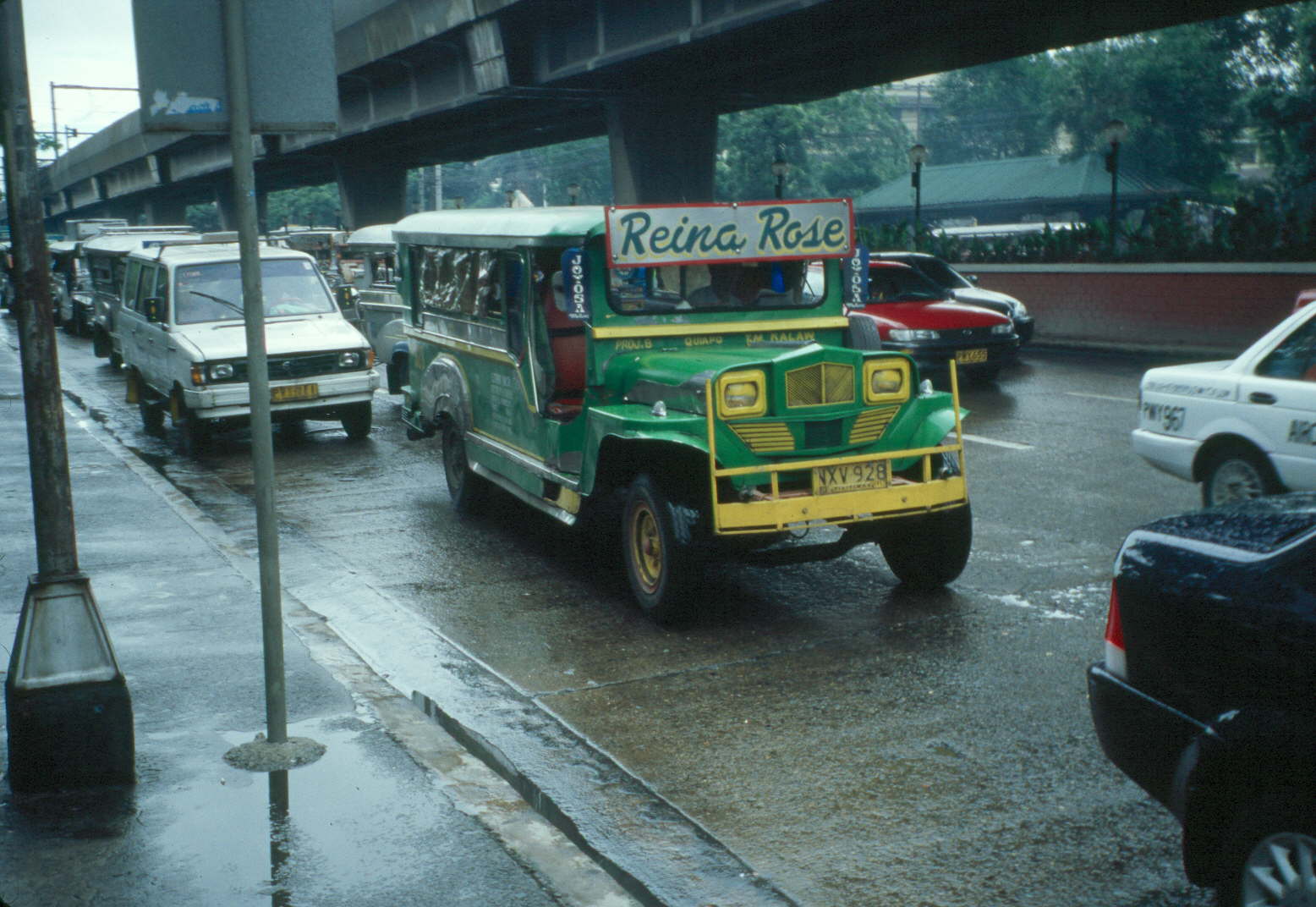 Brightly painted jeepney on a Manila street — the cheapest mode of transit and the visual shorthand for Philippines budget travel