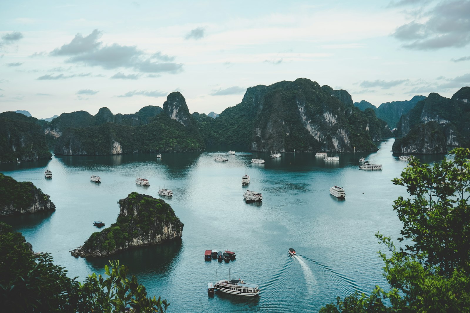 Ha Long Bay karst islands with tour boats