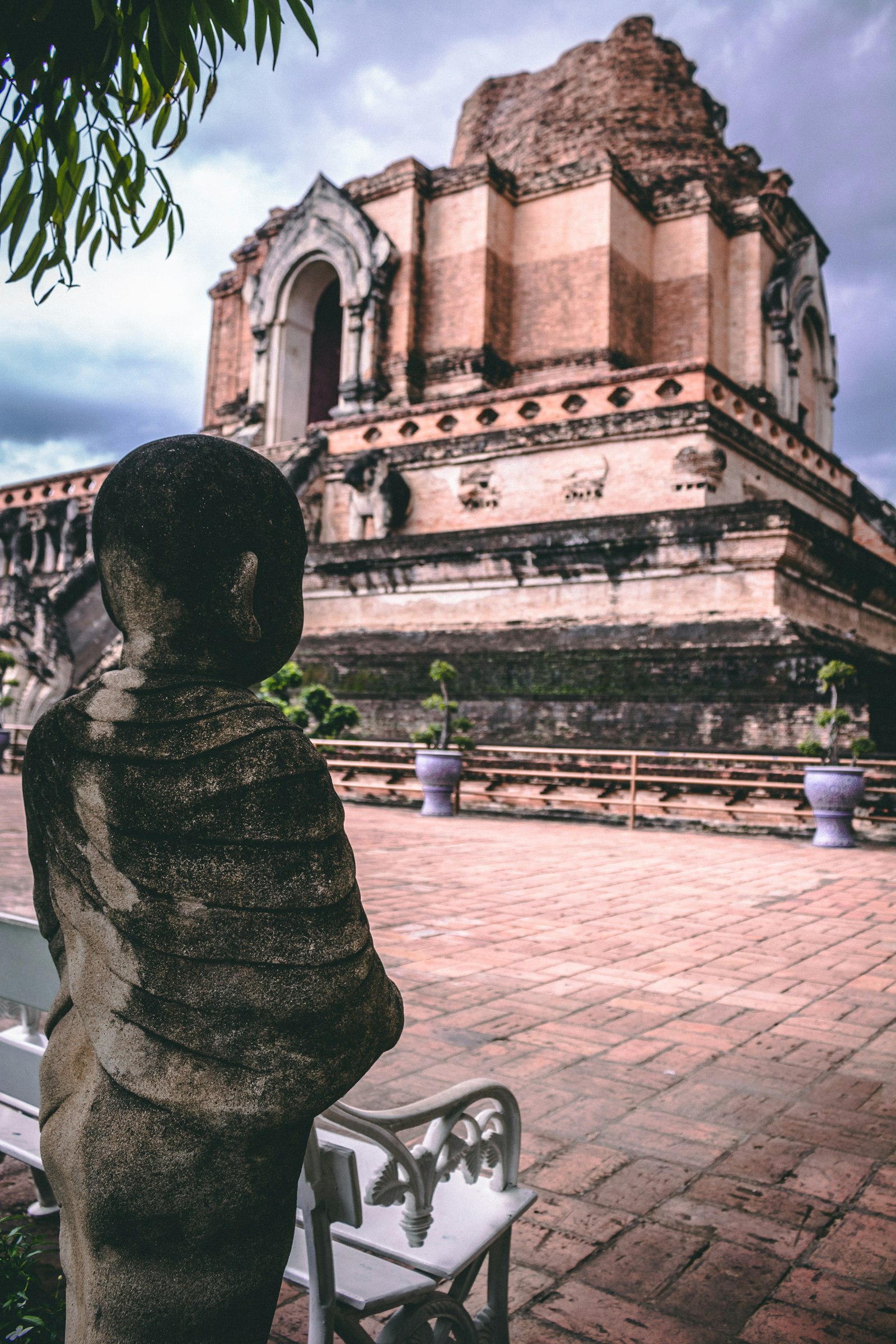 White bench beside Wat Chedi Luang temple in Chiang Mai