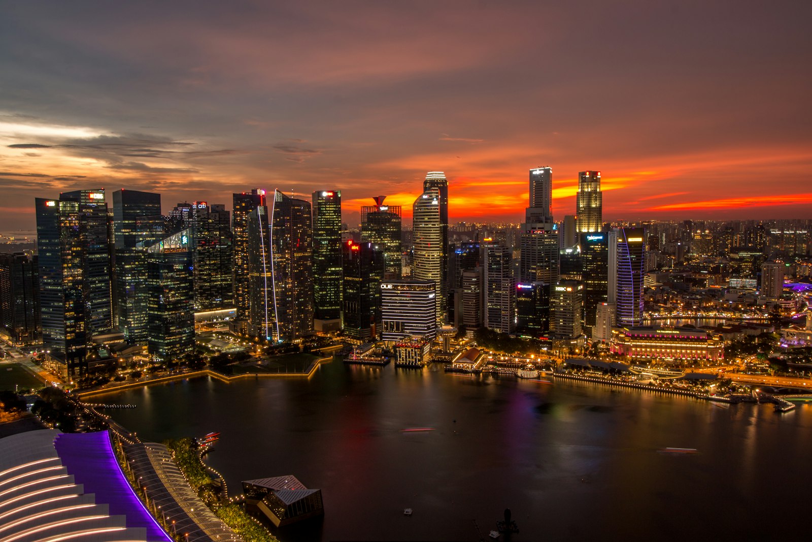 Singapore city skyline at night viewed from the top of a high-rise building