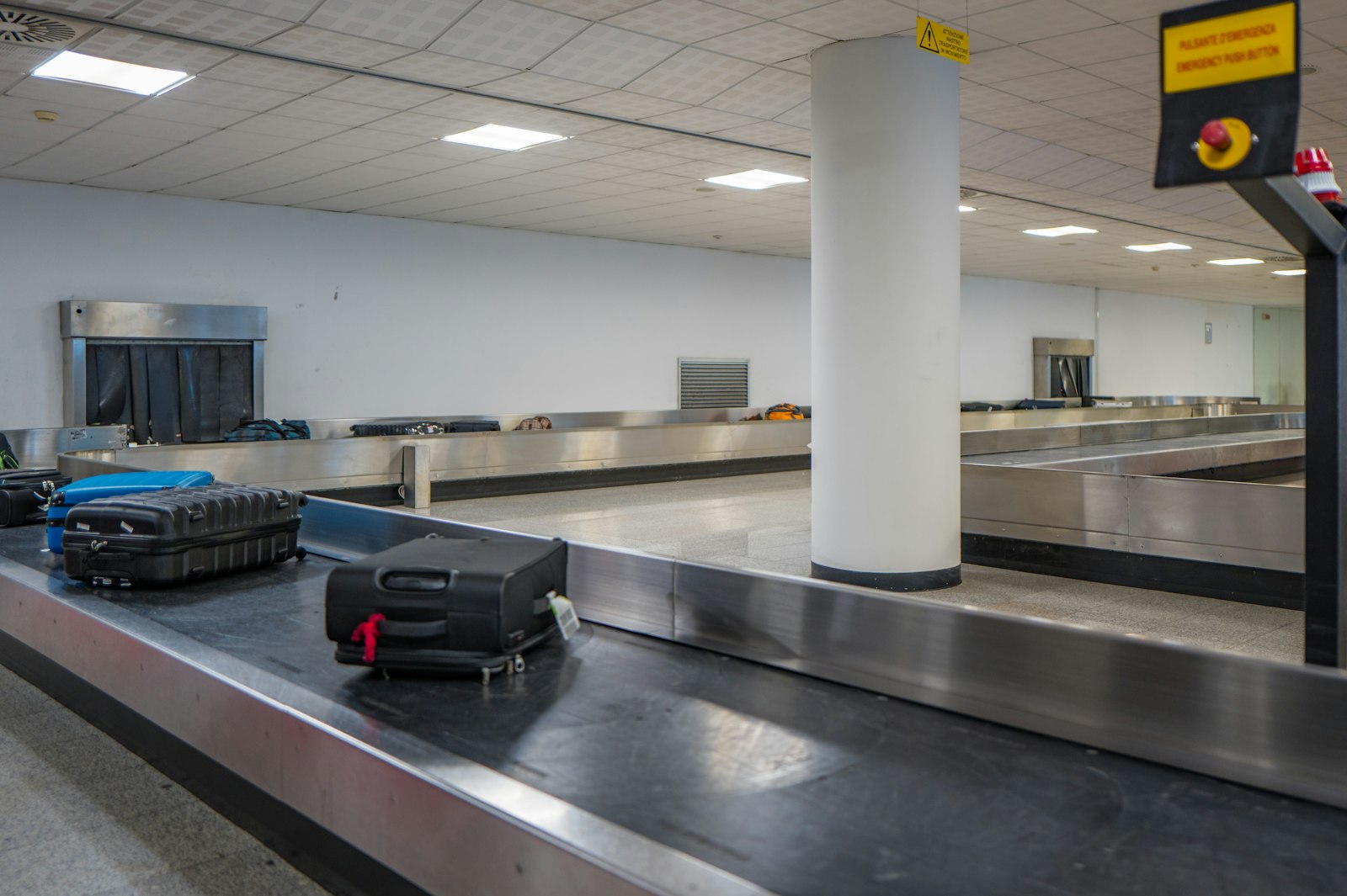 Suitcases on an airport baggage conveyor belt
