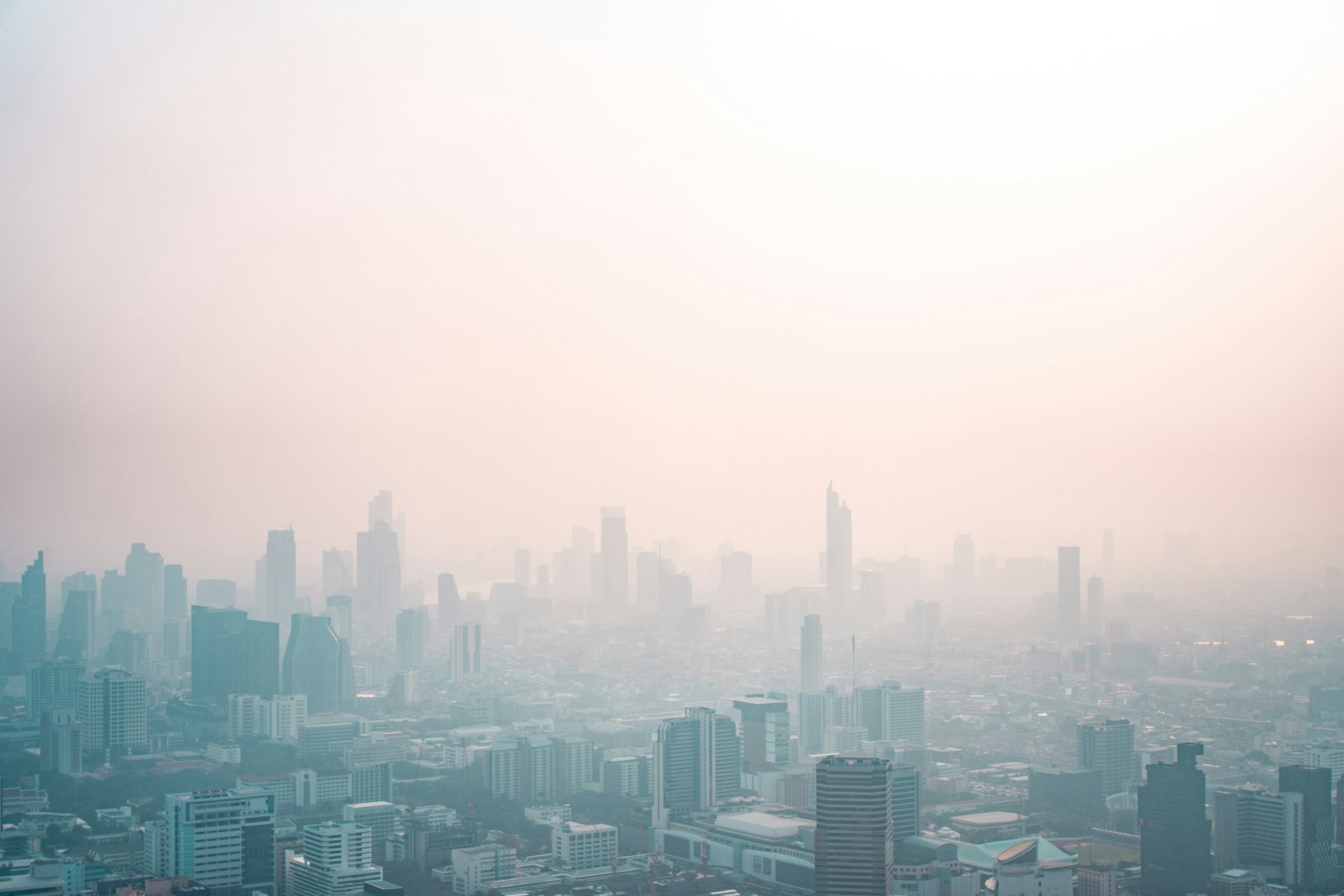 Bangkok city skyline under hazy daytime sky
