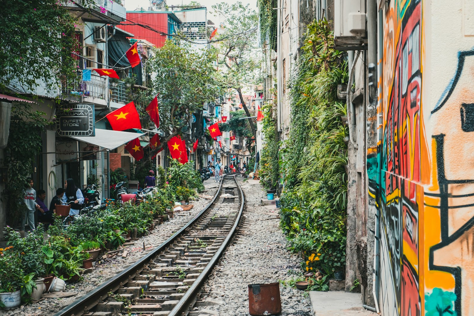 Hanoi Train Street hung with red flags