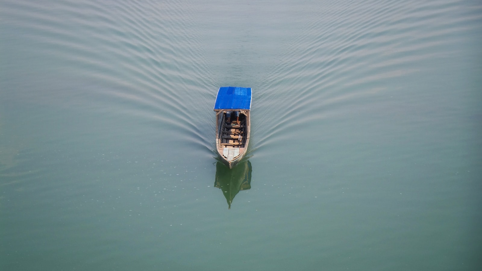 Lone wooden boat on the Mekong River