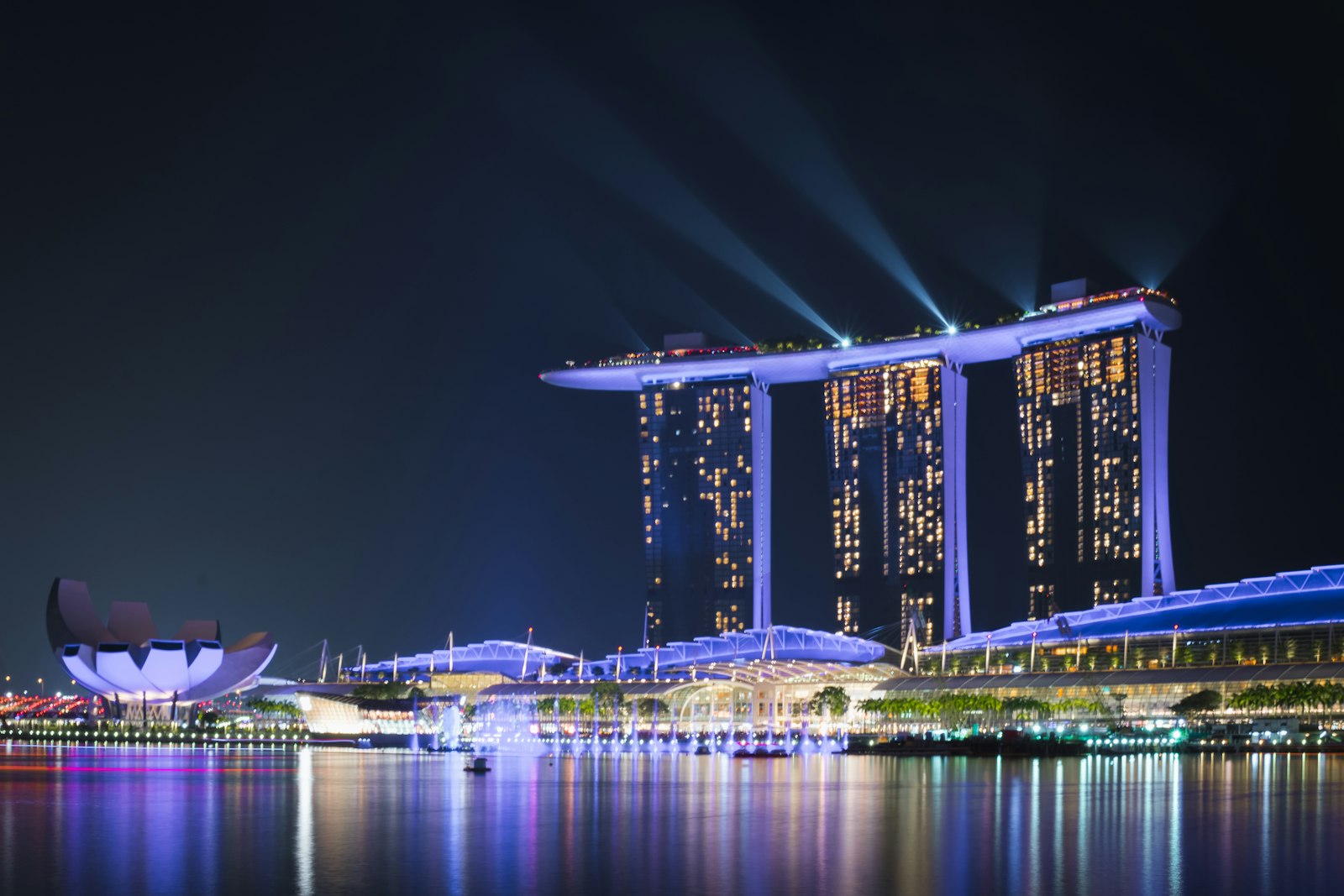 Marina Bay Sands and Singapore skyline reflected on the water at night