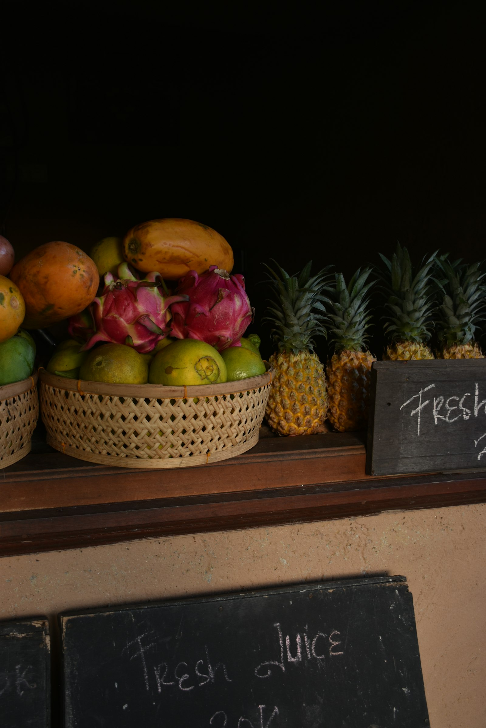 Roadside fruit stand with pineapples oranges and bananas