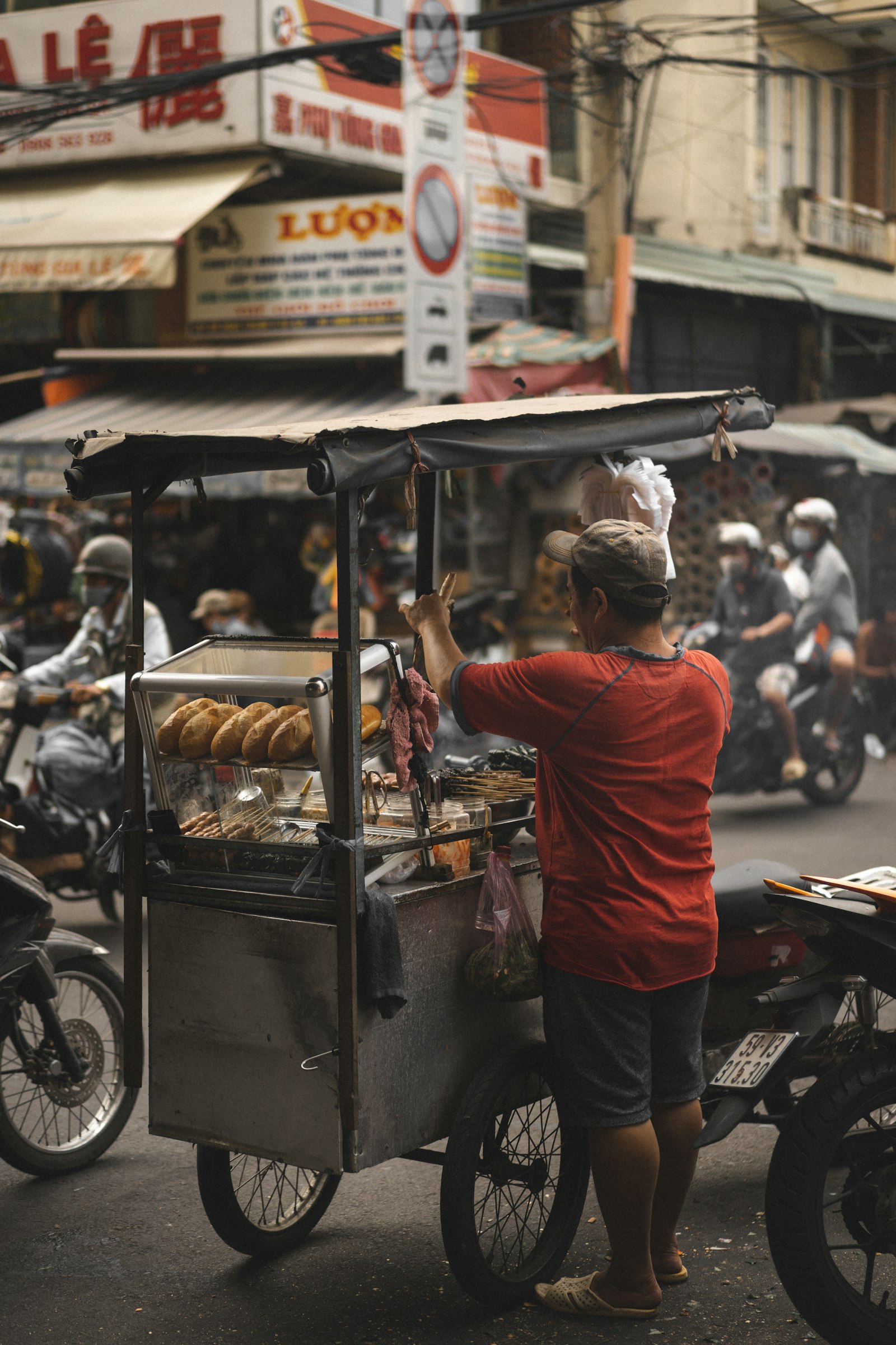Cook at a Southeast Asian street food stall