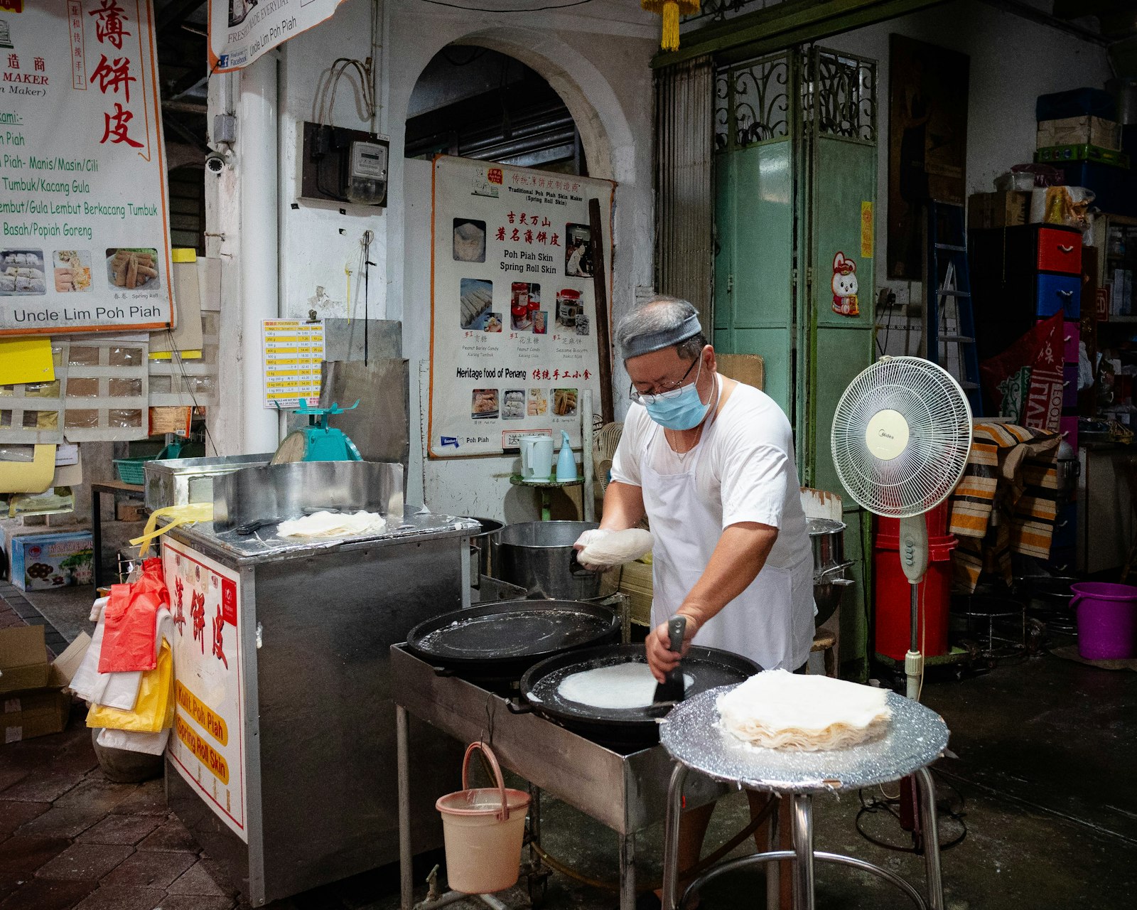 Hawker cook preparing food at kopitiam stall