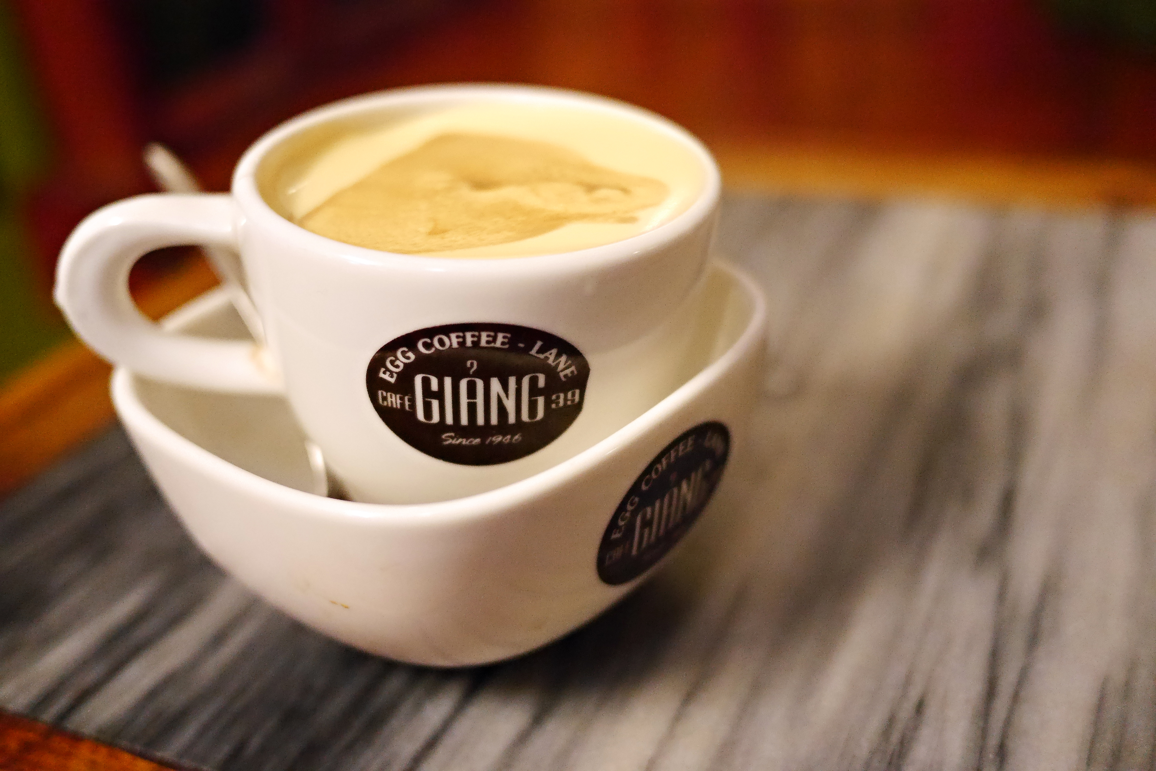 Glass of Vietnamese egg coffee with foam cap